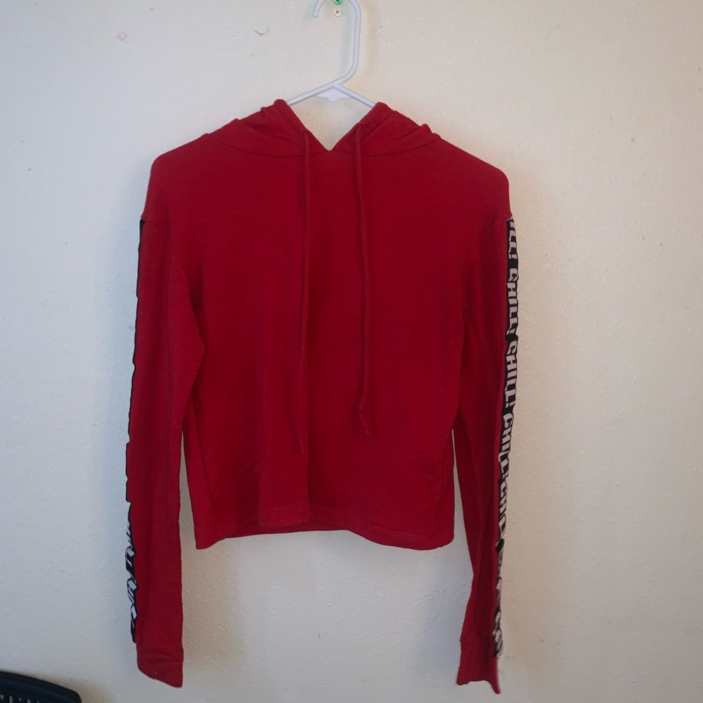 Red cropped ling sleeve with “Chill!” on sleeves